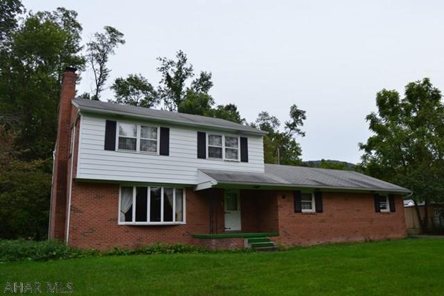 This spacious 3 bedroom, 2  bath home is well taken care of with tons of potential.  Two fireplaces, real oak trim throughout house and hardwood floors under carpet.  Lots of storage space with large closets throughout and a two-car garage. Located on a nice, flat lot in a convenient area within Claysburg.  ( Seller is open to paying a portion of the closing costs. )