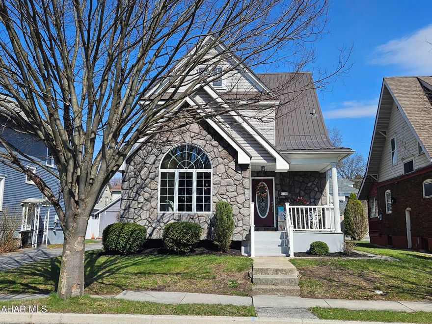 This beautifully appointed home makes a lasting impression from the moment you arrive, offering exceptional curb appeal and a spacious two-car garage. Thoughtfully updated throughout, it features a new metal roof, replacement windows, and all modernized mechanicals for peace of mind.

Step inside to a stunning front living space that includes dramatic floor-to-ceiling windows with an elegant arched top that highlight the vaulted ceiling.  The main level also offers a spa-like full bath complete with a jetted tub--your own private retreat.

The expansive kitchen boasts an abundance of cabinetry and including all appliances, it truly is move-in ready. Generously sized bedrooms each offer ample closet space, with the flexibility for a potential fourth bedroom to suit your needs.

Beneath the carpeting, you'll find hardwood floors ready to be uncovered and restored--adding even more warmth and value to the home.

Enjoy outdoor living on an expansive screened, covered deck--perfect for relaxing or entertaining in any season. This home seamlessly blends comfort, character, and quality updates throughout.