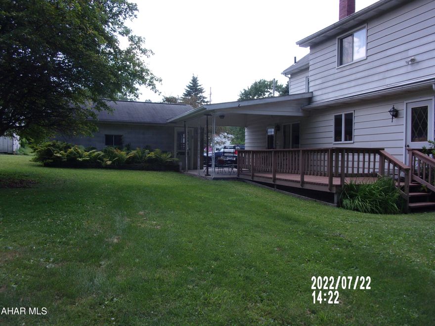 Well maintained home with central air, mature hard woods totaling 3.66 acres, in Altoona Area School District.  Spacious and lovely, shaded back yard along with front and rear covered porches, plus an open deck give lots of choices for outdoor entertaining or just relaxing.  Garden area nurtured for decades.  Rear of property can be accessed from the RV parking, area, an additional driveway.  New 200 amp service and excellent mechanicals.  Several layers of R30 insulation in attic.  City water service but also a spring that could be used for gardens, car washing, etc.  Two staircases and very close to firehall for peace of mind.