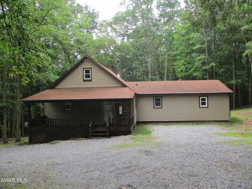 This is a great home in Glendale Yearound! Secluded home with a 2 car detached garage  and parking in the driveway. Nice vinyl sided shed for storage. Covered front porch and covered screened rear porch for comfort relaxing looking over the firepit and custom carved wood bench. The main floor features a kitchen, large living room with a wood stove, family room, full bath, two bedrooms with large closets, a 3/4 bath and a nice laundry/utility room all on the first floor. There is a loft that could be a lovely office or additional living space accessed by the stylish spiral staircase. The house is heated by electric baseboard heat, the wood stove or the two mini splits that can offer heating or air conditioning. This house is ready to be made a home!
