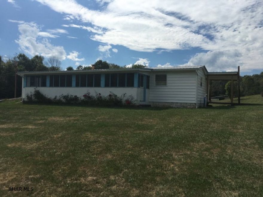 Move-in ready! Well maintained singlewide with enclosed front porch, enlarged living room and a roomy kitchen. Home sits on a full, partially finished, walk-out basement, has a storage shed, 2 car garage, all on 1.16 acres. Beautiful views of the mountains.