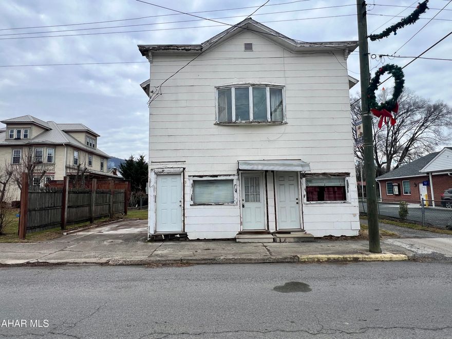 Two story investment property being sold ''AS-IS''. The main floor offers two separated areas both with .25 baths. The second floor offers two bedrooms, one bath, living room, and kitchen.
