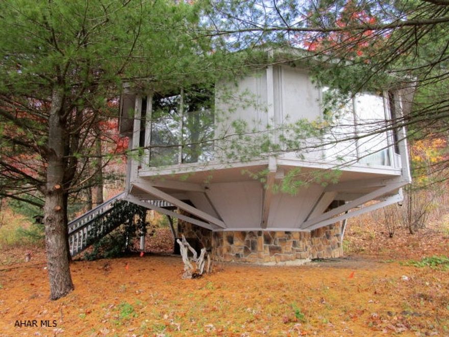 Nice topsider home just steps away from the Omni Bedford Springs Resort and Golf Course. Home features a LR with wood burning stove, kitchen with eat-in area, two bedroom and 2 full baths. Finished lower level with rec room. Heat pump with central air, appliances and wrap deck with wooded views. Use the newly completed walking/jogging trail from the Omni into Historic downtown Bedford, many shops, restaurants and historic buildings to view!