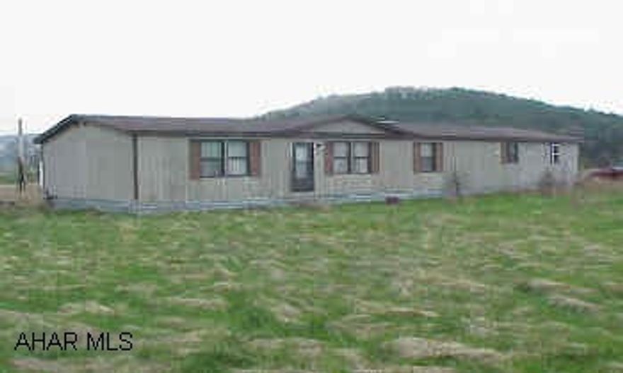 1989 Champion 24x50 doublewide with 14x26 addition.  24x40 barn and pole building.  Level and clear ground. East St. Clair Twp