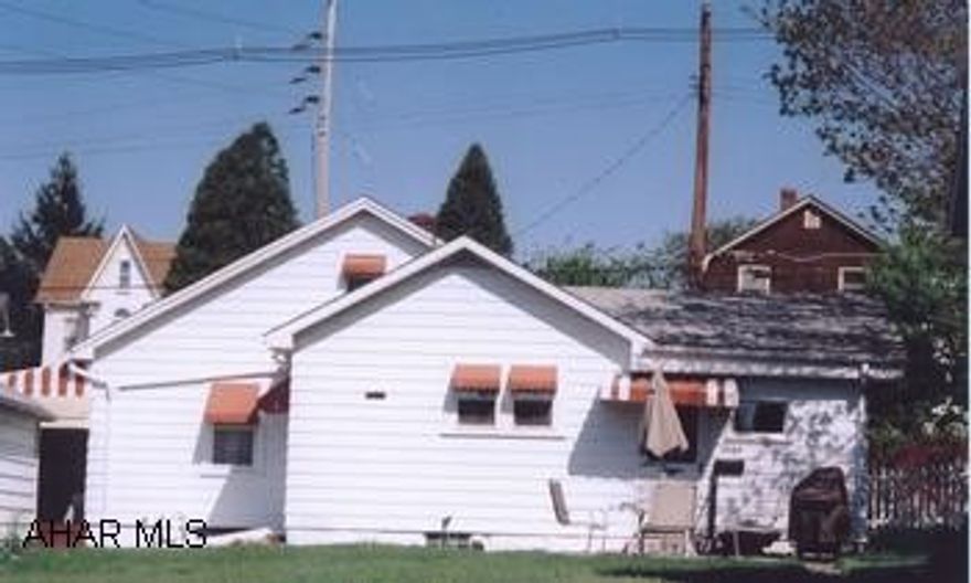 One-story frame house on corner lot featuring 2 bedrooms, a family room, and central A/C.