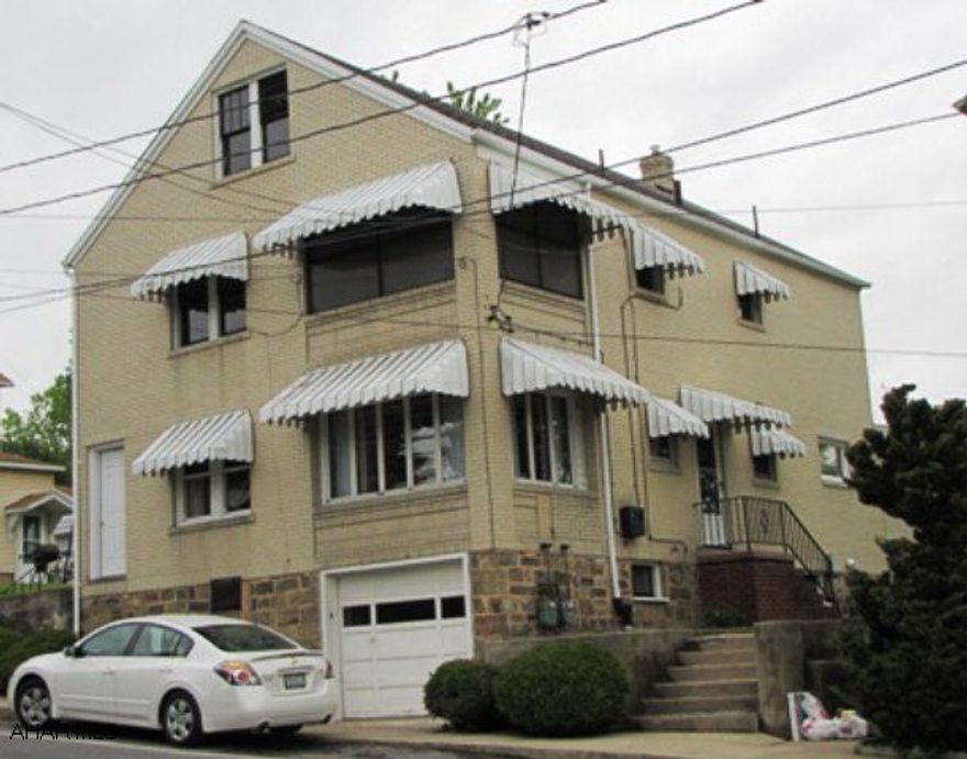 Presently a duplex - very well maintained.  Could be turned into single family.  Live in the bottom and rent out the 2nd floor.  Very nice eat in kitchen, hardwood floors in bedroom.  All brick building, nice patio, garage, shed.  Average heat bill $109.00 per month, for both units.