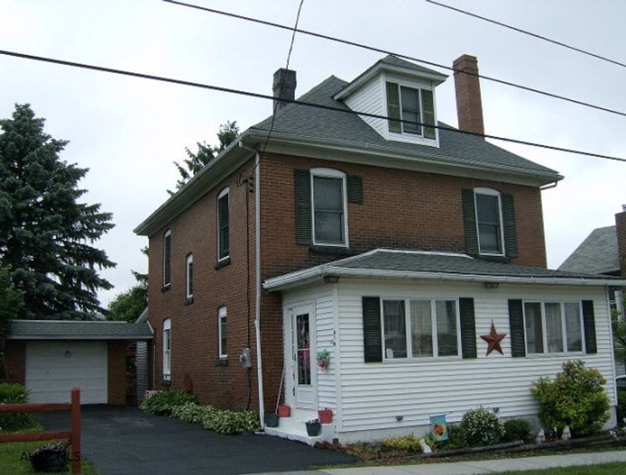 Patton- 3-4 BR, 2 bath brick 2 story home with an Eat-in kitchen and a wood burning fireplace in the LR.  1 car attached garage. Oil HW heat.