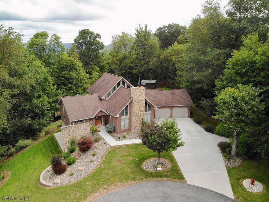 Location, Location Location, Immaculate custom, well built home w/spectacular views, over looking Downtown Bedford. Sitting next to 2500 acres of recreation trails. Custom made oak cabinetry, solid oak pocket door,kitchen island w/pantry, recess lighting and a lovely dining nook. Open, spacious great room, pine cathedral ceiling, stone gas fireplace, and lg floor length windows to enjoy the outdoors from with in.  A 42" wide staircase leading to the 2nd FL bedrooms, office and bathroom. Master Suite, pine cathedral ceiling and skylight, French doors open out onto a balcony with beautiful views. Master bath has a separate ceramic shower, built-in bathing tub, lg closets and his and her sinks. Family/Rec/Man Cave is great for that evening of entertaining and relaxing. 100x160 extra lot.