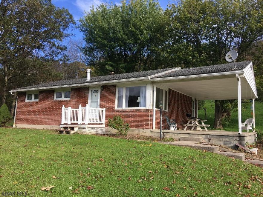 Brick ranch with a private setting! Oversized 28 x 24 detached garage with metal roof with a finishable upstairs. Furnace 2011, garage roof 2017, hot water tank 2013. Hardwood floors, side-covered porch, back deck all in a great location!