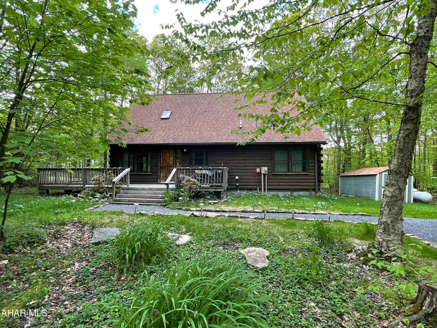 This beautiful 3 bedroom, 2 bath log home in Blue Knob offers an abundance of privacy on a serene .32 acre lot.  With stunning cathedral ceilings, this home combines rustic charm with modern comforts.  Perfect for those seeking a peaceful retreat surrounded by nature.  Use as your primary residence or secondary residence and Airbnb. HOA fees include road maintenance and trash