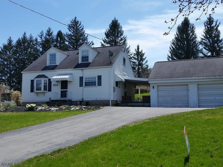 3-bedroom vinyl-sided home w/updated Kitchen & Bath, central air,  private back yard, nice patio w/outside fire ring & 2-story 2-car garage on .6 acre. J-423