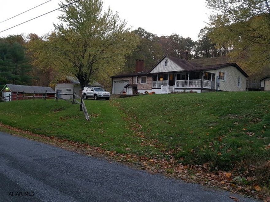 Raised Ranch newly remolded with new heating system, new flooring, new plumbing.  With two small sheds, large block building and red barn on 5 acres nestled in the mountains but close to town.