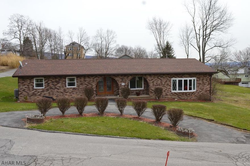 Very well maintained brick ranch house with large yard and corner double lot in a quiet neighborhood. This home has been recently updated to include; exterior doors, windows, central air, and modernized kitchen and bathrooms. The main attraction is the massive sunken great room with vaulted ceilings and exposed beams and a 3 sided bar perfect for entertaining or celebrating. The large eat in kitchen boasts solid oak cabinets and recessed lighting in addition to newer stainless steel appliances. The master bedroom also has a large walk-in closet with built in shelving and a recently updated en suite with tile floor and granite vanity. The common bathroom was updated with a unique floating vanity and marble vessel sink. Too much to list, call today for your private showing!