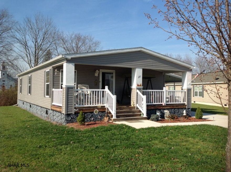 Upscale 3 bedrooms, 2 full baths, 2013 Champion Doublewide home with a carport. Land not included. Concrete diveway and shed for storage. Situated in a 55 and older retirement community.  This home can stay or be moved to another location. Monthly rented lot.  This kitchen has a corner sink and Island with bar stools and a separate dining area for more seating. Master bedroom has a walk-in shower for easy access and walk-in closet. The living room is dry walled and cathedral ceiling.