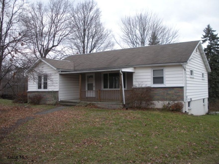 Hollidaysburg School district 4 bedroom 1 bath.  1 story home on just under 1/2 acre lot.  Hardwood floors throughout.  There is a ton of potential to this home.  2 car garage, covered front porch.  Central A/C. 100 amp breaker panel.