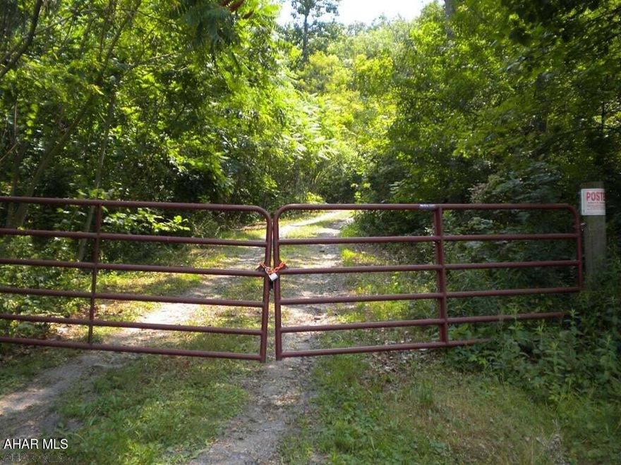 46.09 wooded acres off of Reservoir Road in Hollidaysburg. This property is bordered  by State Game Lands...Only access to State Game Lands on that side of the mountain. Breathtaking views from the top of the property. Small cozy cabin on the property. Property is currently under Clean & Green. Call listing agent for directions on access.