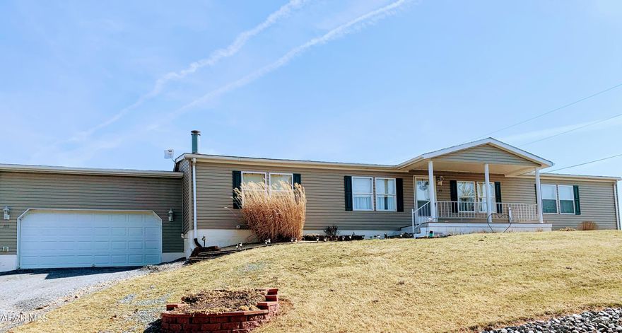 Discover comfort and convenience in this well-maintained, single-story manufactured home featuring an oversized one-car garage with an attached storage room. This 3-bedroom, 2-bathroom home offers a spacious master suite with a walk-in closet and a luxurious two-room en-suite bathroom with a double sink.

The open-concept eat-in kitchen includes an island and flows into a bright dining room and a cozy family room with a fireplace. A separate living room provides additional space for relaxation. The full bath features a skylight for natural light, and the laundry room, located off the kitchen, includes a pantry for extra storage.

Enjoy the outdoors from the large, rear covered Tyvek deck overlooking beautiful views. The property also includes a detached shed for extra storage. Recent updates include a newer roof, furnace, and flooring. Central air. All situated on nearly half an acre.

Schedule your showing today!