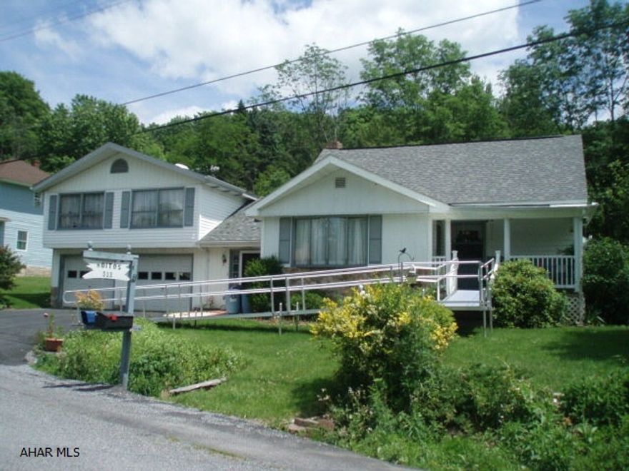 Bi-level home with 3BR, modern kitchen, and almost one acre lot.