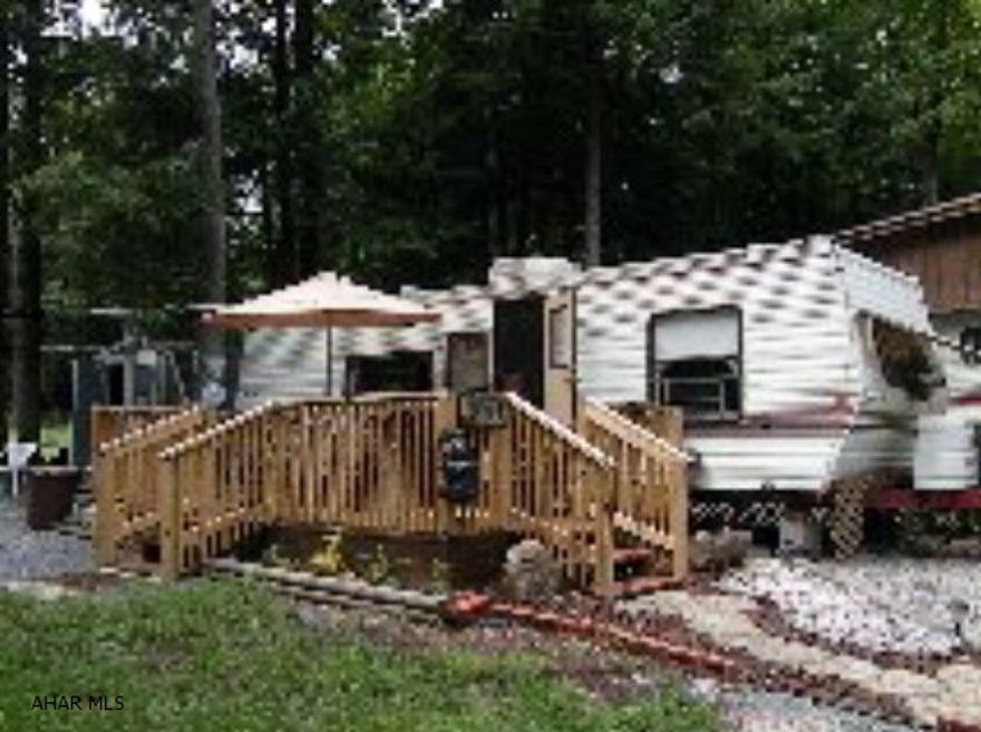 GREAT WEEK-END get away! MOTIVATED SELLER- LOOKING FOR OFFERS!!- Sleeps 6, nice deck & shed. Also has an outdoor fireplace & fire ring for cooking hot dogs & mountain pies. All the amenities of GYR including a heated pool