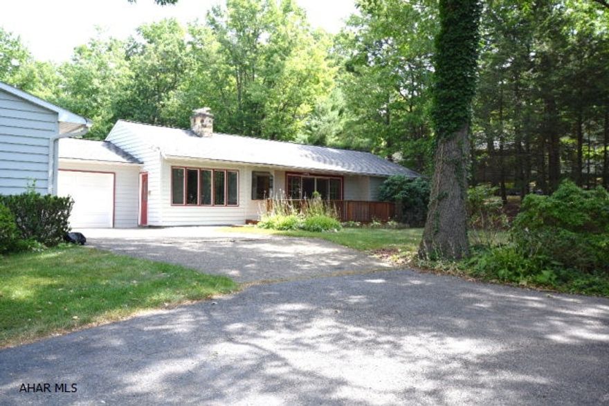 Very well maintained one story home with the kind of kitchen everyone wants... BIG, and beautiful.  Birch cabinets, ceramic tile floors.  French doors to patio.  Large living room with pretty hardwood floors and wood burning FP, Spacious master bedroom with jacuzzi tub in master bath.  Finished basement with lots of space for entertaining.  Three car garage and 1.17 acre level lot.  Long paved driveway provides plenty of off street parking for all of your family events.  Private lot.