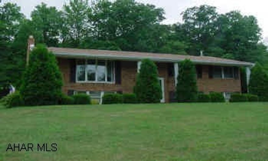 Split Entry on 9.9 Acres of Country setting just minutes from Prince Gallitzin State Park Attractive home very well maintained with large Family room with wood burner and bar area.
