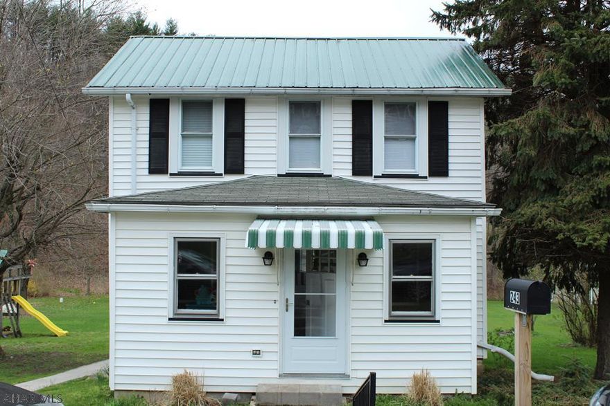 Cute as a button. 2 story ready to move in. Freshly painted throughout. Easy care, new flooring. Bathroom has been completely remodeled. 3 bedrooms. Nice lot that has a small stream. Home is not in flood zone. Great started home.