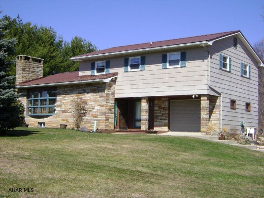 This turn-key home, in a great location, sits on a level .75 acre lot with easy access to I99, Altoona and/or Bedford.  Here you will find beautiful knotty pine walls and ceilings, spacious rooms, a large family room in the basement, a back deck that is great for outdoor entertaining and lots of garage space.