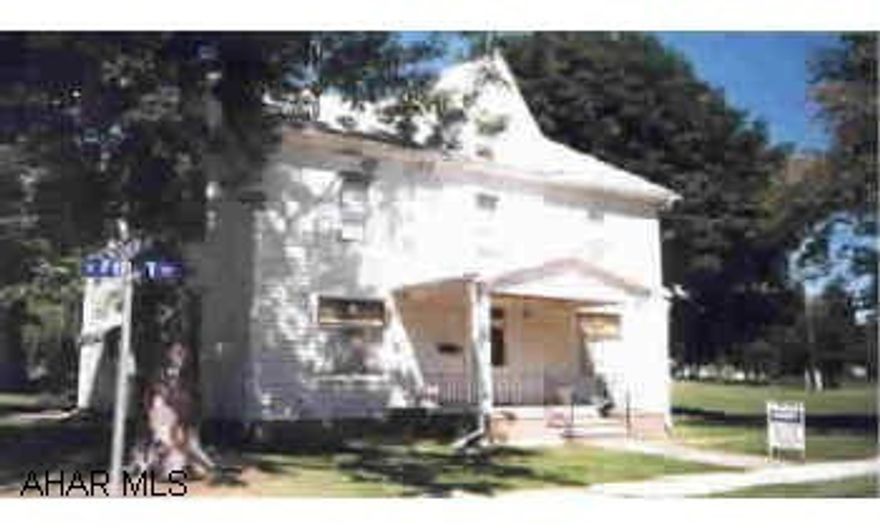 Gracious older home on lovely corner lot. Center entrance with stairway to 2nd floor. Large living room. Bow window in dining room and upstairs bedroom. 2 ranges downstairs stay, antique kitchen range and kitchen light fixture do not stay! Attached covere Gracious older home on lovely corner lot. Center entrance with stairway to 2nd floor. Large living room. Bow window in dining room and upstairs bedroom. 2 ranges downstairs stay, antique kitchen range and kitchen light fixture do not stay! Attached covered patio and carport - generator in basement.