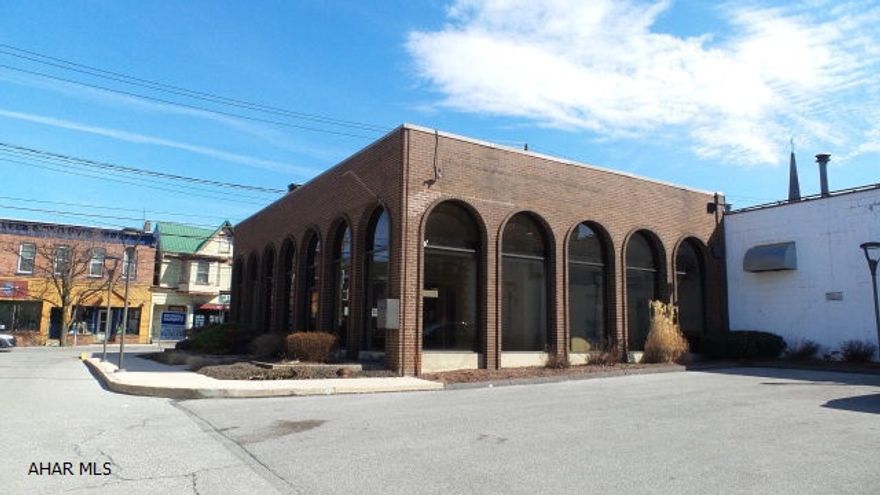 All brick building in great condition! Former bank location with offices, partial basement, 2 bath and kitchen area! Off street parking, great curb appeal.