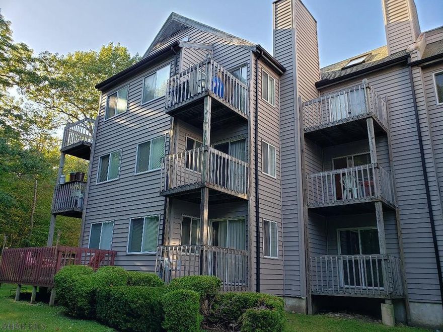 Nice 2nd floor studio condo with alcove bed, fireplace & balcony - sleeps 4.  Electric system is breakers.  $255/mo HOA dues include:  outside maintenance, indoor & outdoor pools, hottubs, + tennis court usage.  4-seasons resort:  Golfing & skiing for a fee.  Sq ft per tax card - buyer to verify sq ft & taxes.  J-490
