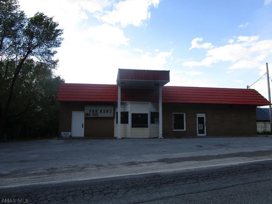 Brick and block one story commercial building formerly used as a dairy store.  Possible multiple uses with some remodeling (office space, retail space, pizza shop, etc). Paved parking lot and frontage on rt 36 which receives above average traffic flow. Great value for the $$.