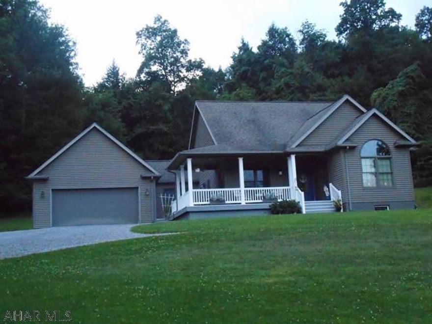 As new one story home on 2.4 acres. This home features equipped kitchen with hickory cabinets, dining area - large living room with cathedral ceiling, 3 bedrooms and two baths. Attached two car garage and a 24x40 detached garage. Well insulated and easy to heat with 4 zone oil hw. Nice setting away from the hustle and bustle found with most homes. Within a 40 minute drive of the city.