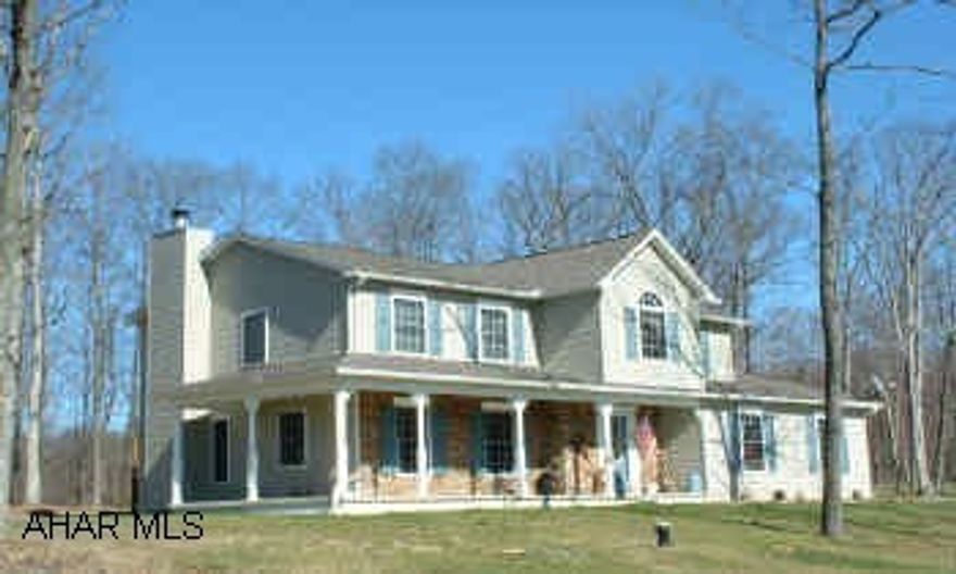 4BR/3 1/2 BA energy efficient 3 yr. old custom 2-story on secluded 10+ acres wooded hilltop setting with glorious views. Includes 24x34 pole barn, Horses OK. Wraparound covered porch, oak and tile floors, 35 yr. roof, 5 zone heat, central air. Light and airy kitchen and family room with stone fireplace. Custom oak kitchen cabinets, island counter and breakfast bar. All kitchen appliances convey. MBR suite w/delux whirlpool and fixturesplus large shower.2nd floor laundry washer/dryer convey. Partiall finished basement w/rec room and office/bedroom.