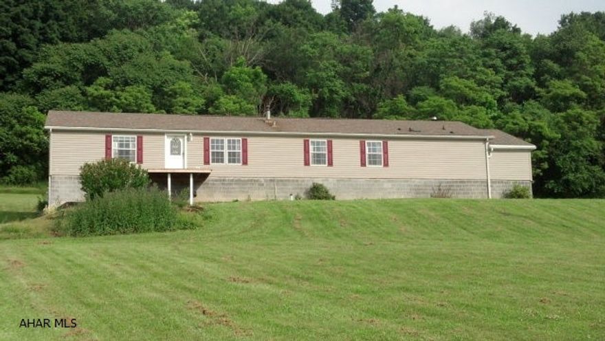 Hollidaysburg School District with 3 BR and 2.5 BA on private, 6 acre setting. This large double wide offers 2100 sq ft of living space and full walkout basement. If a private setting with breath taking views is your desire, here it is at an affordable price.  This sale is subject to short sale approval.