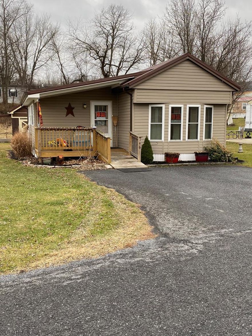 Updated 12' x 66' Victor mobile home with a 12' x 20' addition located in relaxing Friendship Village.  Enjoy all the extra amendities and entertainment offered or just sit back and take in the tranquility of the waterfront view. This home offers 2 bedrooms, 1- bath with a walk-in tub, eat-in kitchen with a built-in hutch, newer carpeting and pergo flooring, thermo pane windows, 200 amp service, newer metal roof and vinyl siding and fresh paint.  Shed with electric service is included. Appliances stay with property.