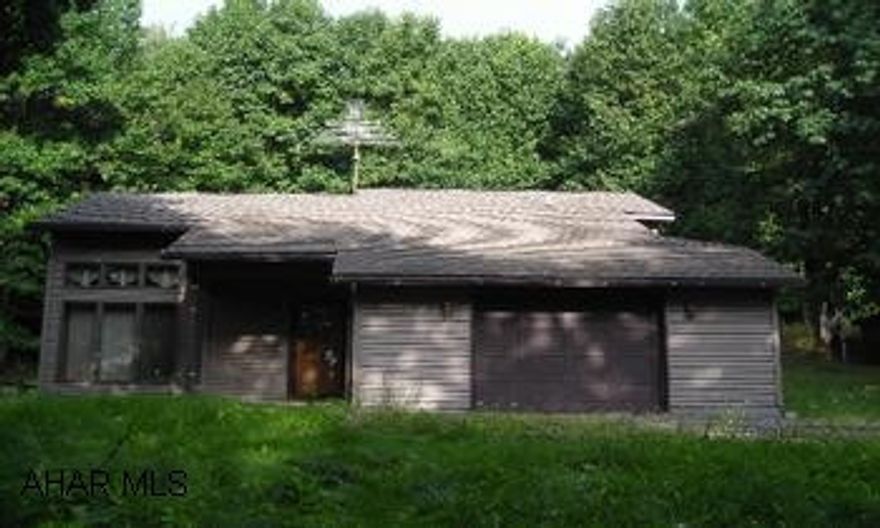 Nice opportunity here - 2 bedroom contemporary on 10+ wooded acreage.  Subject to short sale.  Show and sell! Nice opportunity here - 2 bedroom contemporary on 10+ wooded acreage.  Detached 3 car garage, outdoor furnace, basement, deck. Subject to short sale.  Show and sell!
