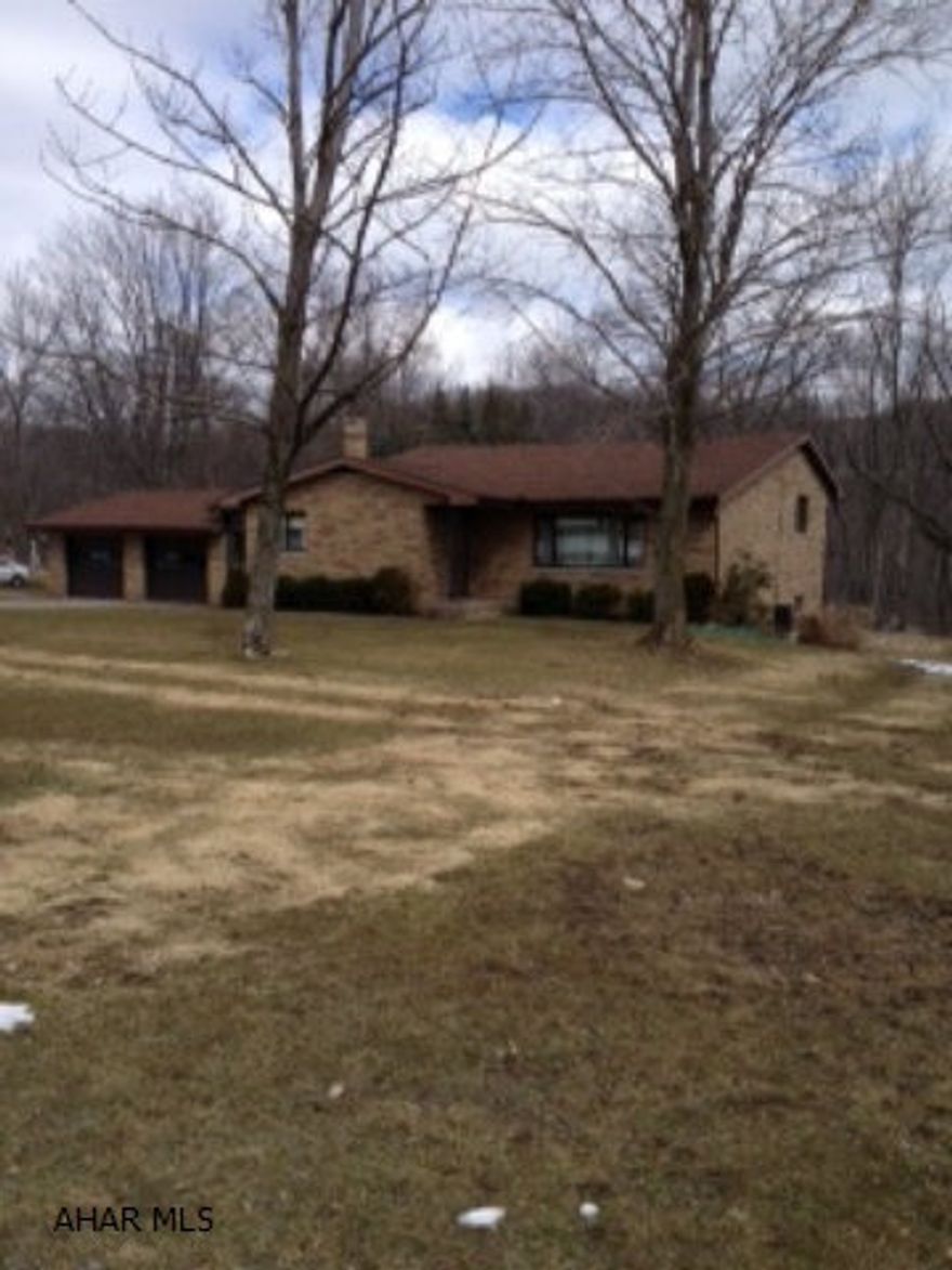 Very nice solid and immaculate brick home on 1 acre. Hardwood floors throughout, nice size bedrooms and huge lliving room. Finished lower level with full summer kitchen opening to large covered porch and huge back yard. Breezeway is heated and cooled and leads to the 2 car garage, 3 zoned heating system, public water available at street level. Newer mechanics, new roof June 2012.