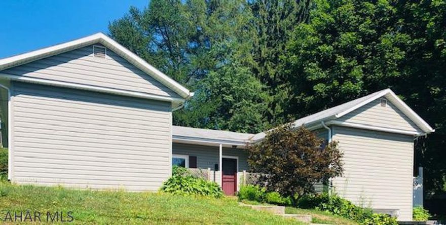 Bring your ideas to this one! Large three bedrooms. Some paint and  new carpeting would make it nice. Great location.