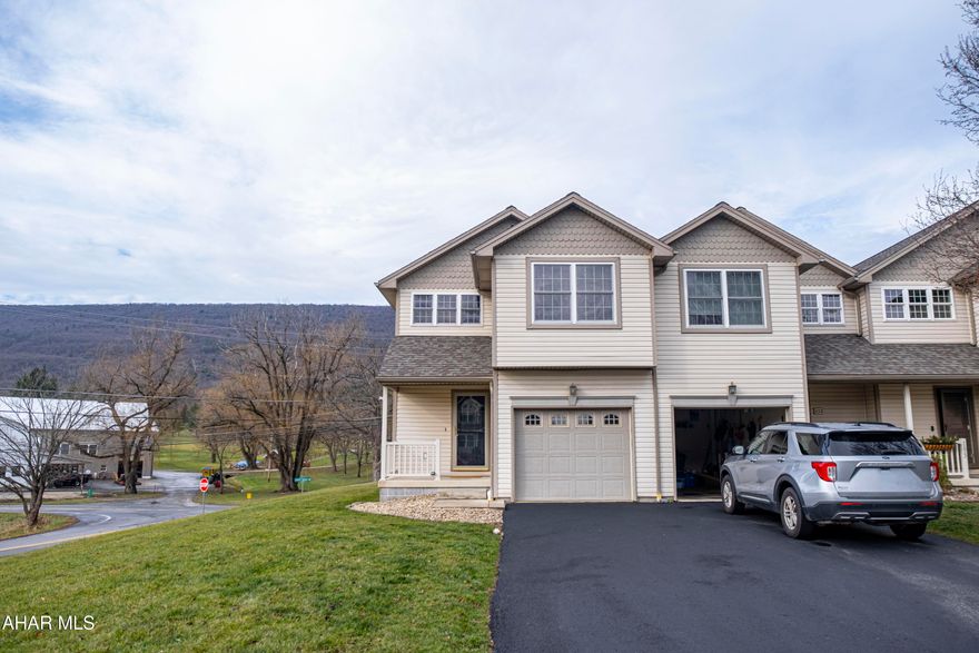 Beautiful three bedroom end unit townhome with two full baths and one half bath.  The kitchen is open to the living room which leads out onto a spacious deck. Enjoy magnificent views watching the sunset over the mountains. Finished basement adds additional living space. New roof in 2023. Heat pump & UV light new in 2022.  Hollidaysburg School District. Schedule a showing today!