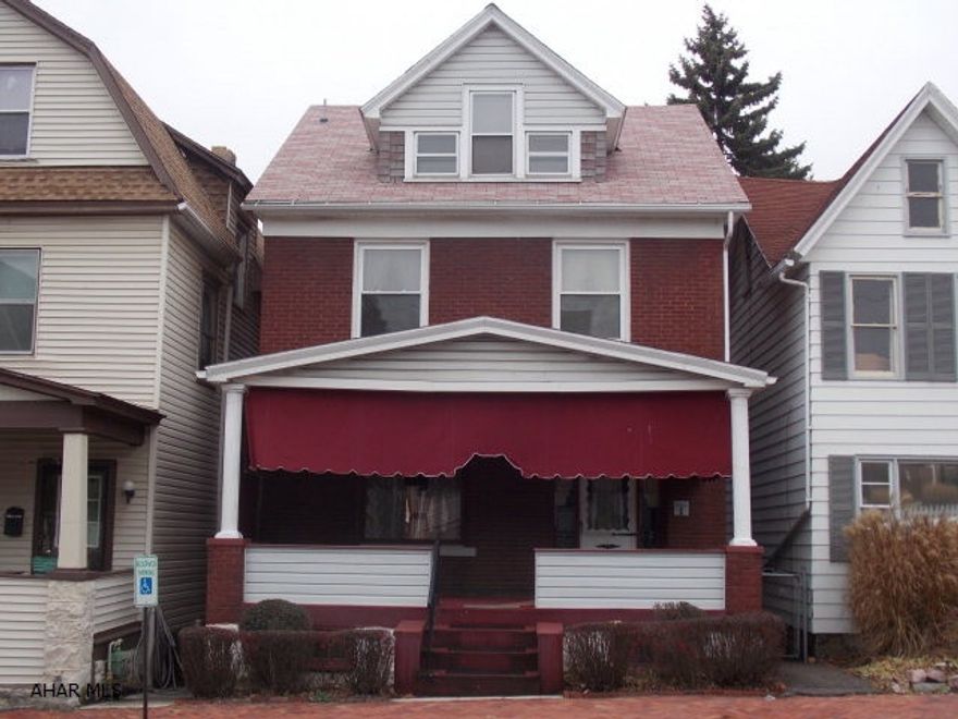 All brick home with large front porch and huge deck. Beautiful orginal woodwork and built-in book cases add so much charm and character. Hardwood floors under carpet in Living Room and Dining Room. The kitchen and bath have been updated, roof was new in 2014 and new patio doors in dining room lead to a deck with a view of the fenced in back yard. Great starter home with 3 bedrooms and a finished attic, convenient location.