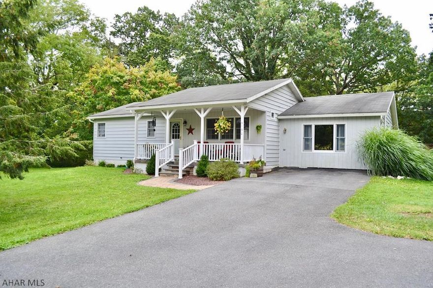 Nestled on a private two acre wooded setting, this ranch home in Snake Spring Township is exactly what you have been looking to find.  A central great room with updated maple kitchen, granite counters, black stainless appliances, and hickory hardwoods, opens to both a front covered porch and rear composite deck.   Three bedrooms, updated main and master bathrooms, large family room and main level laundry.   A wonderful wooded property with mature oak trees, 2 sheds, walking paths and more.   An absolute must see in the Bedford School District!