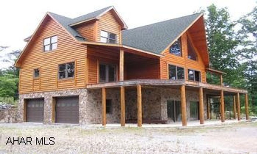 Elegant log sided contemporary on 70 wooded acres, 3BR/4 1/2BA. 2-car integral garage. Elegant log sided contemporary on 70 wooded acres. Still under construction with material on site. Plus mobile home with own well, septic and 2-car detached garage. Central heat/AC, central vacum system, wraparound deck, hardwood floors, woodburner in stone fireplace in great room. Secluded location.