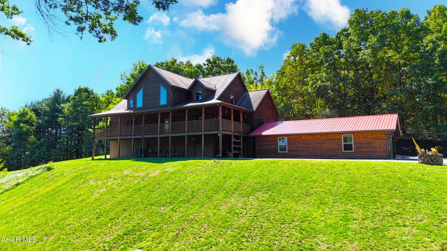 Here is your opportunity to own the log home that you have always dreamed of! This conveniently located custom-built log home offers a wow factor as soon as you walk in the door with the vaulted ceilings and beautiful woodwork. The main level consists of a great room with a stone fireplace offering an open concept that flows into the dining area and kitchen. The main level also includes two bedrooms, two bathrooms, and a convenient 1st floor laundry. The upstairs loft overlooking the main level could be used as another bedroom, office, or bunk room. The partially finished basement offers additional living space, complete with another 3/4 bath, work area, and utility room. Outside, you will find a covered front porch offering a place to take in the surrounding views, a rear deck, and an oversize garage.