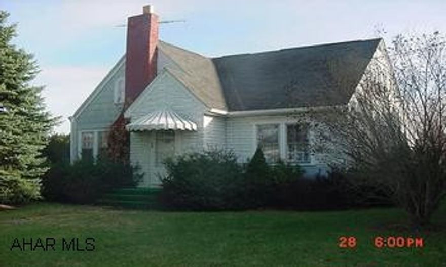 1 1/2 story on 2 lots. Move in condition Far back lot is excluded.  Beautiful hardwood floors, attractive fireplace, large 2 car garage w/ addition and work shop above