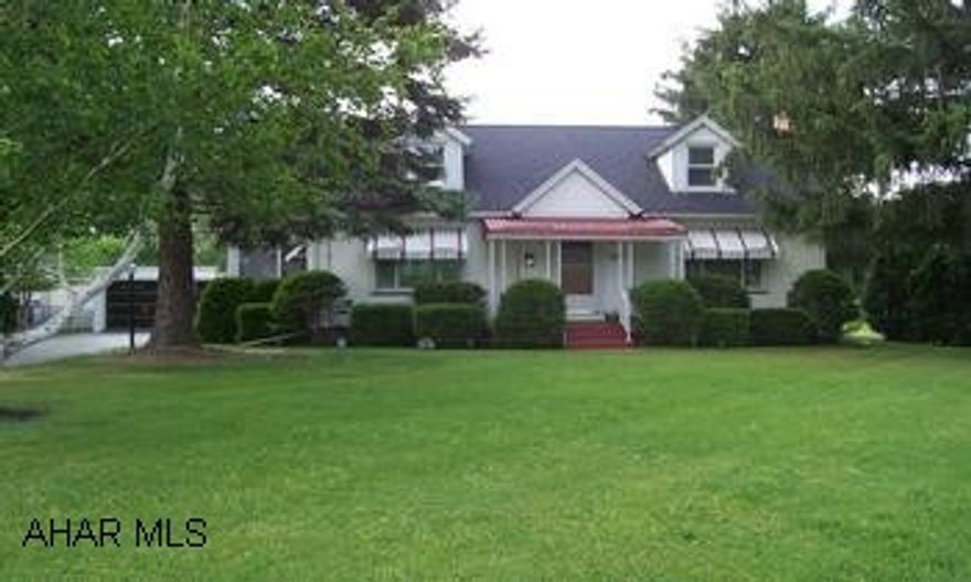 1 1/2 Story - 3 Bedrooms - 1 3/4 Baths - Vinyl Siding - Newer Windows & Central Air Charning 1 1/2 Story, Sitting On Over An Acre Of Land- 2 Car Detached Garage - Natural Woodwork & Hardwood Floors