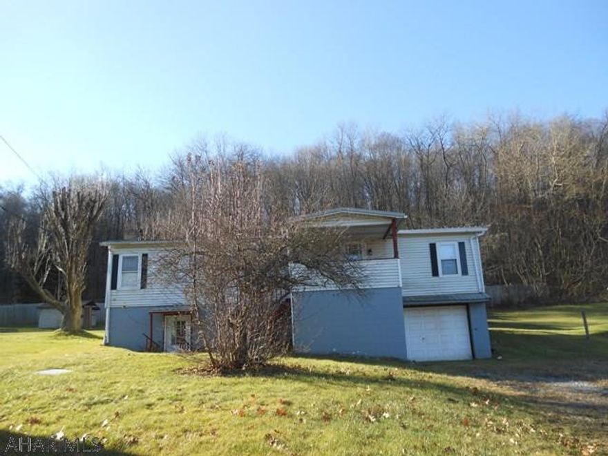 This is a manufactured home on a foundation just outside of Portage. This home has a nice 1.1 ac lot. The home as an integral 1 car garage. The first floor features a living room with wood fireplace, kitchen with eat in area, full bath, four bedrooms and a full bath including a shower stall and soaker tub. With some work, this house could be your home