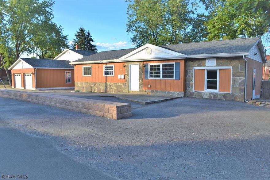 OPPORTUNITY ABOUNDS ON OAK STREET!  This home is MUCH larger than it appears & offers many options from single-family living to use as an income-producing property(most recently a student rental). The home has 2 kitchens-one near new, other with brand new counters & all appls stay! 2.5 baths. The "main" house has anywhere from 3-5 BRs depending on what you prefer & has hardwood, luxury vinyl plank & ceramic tile floors, as well as many bright & freshly painted rooms. If working from home has been your thing, there are perfect office spaces to separate work/home life. The garage is HUGE with an extra room downstairs & a large finished upstairs w/mini split for heating/air. Roof(2017), Furnace/AC (2017). This is one you have to see to appreciate-SO MANY POSSIBILITIES!