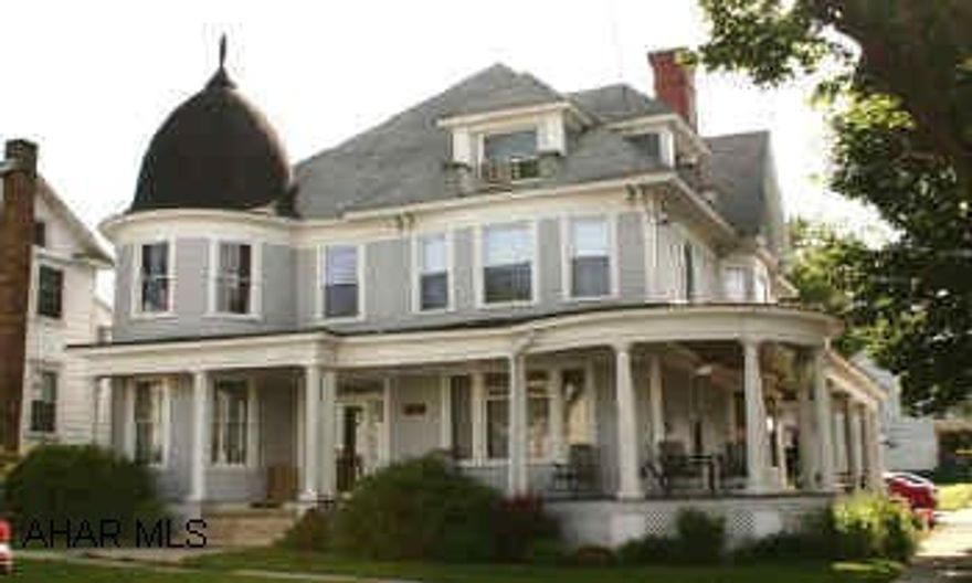 BEAUTIFUL VICTORIAN HOME WITH HARDWOOD FLLORS, ORIGINAL QAK TRIM, POCKET DOORS, CHERRY KITCHEN CABINETS, FINISHED THIRD FLOOR, 1-1/2 BATHS AND LARGE WRAP-AROUND PORCH.