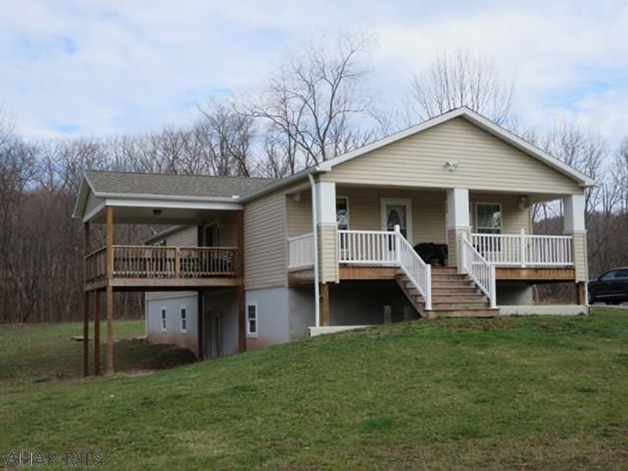 Like new (built in 2013) three bedroom rancher on 12.5 acres. Borders Bob's Creek. Two full baths including master bath. Basement is partially finished and would not require much to complete. Large rooms, large front porch and deck. Property is in a flood zone although the home has never been wet.