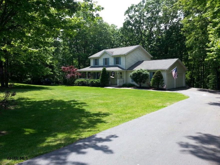 Character and Charm in private peaceful setting! Spacious and comfortable 3 bedroom with front wrap around covered porch 2 car attached garage and large 16 x 22 deck overlooking wooded back yard. Terrific recreational space in finished basement great place to entertain complete with built in bar.